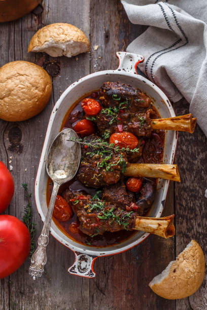 Turkish cuisine braised lamb in tomato sauce with spices and herbs stock photo