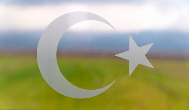 Turkish flag signs star and crescent icons over the window stock photo