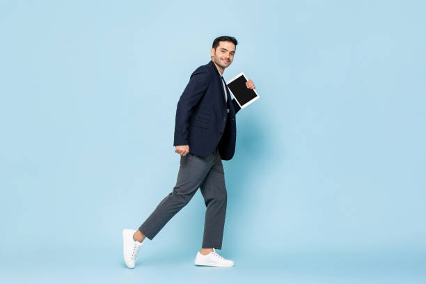 Turkish manager with tablet walking stock photo