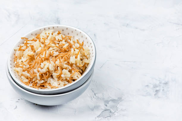 Turkish national side dish. A pilaf of rice and fried noodles. Light photo with copy space. stock photo