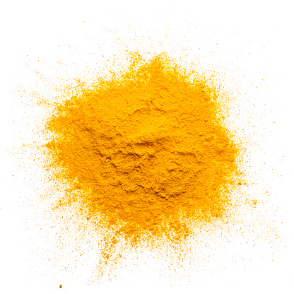 Spices: overhead view of fresh organic turmeric powder heap isolated on white background. Predominant color 1s yellow. High resolution 42Mp studio digital capture taken with Sony A7rII and Sony FE 90mm f2.8 macro G OSS lens