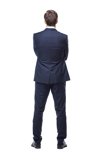Turning his back on business A full length rear view studio shot of the back of a young businessman rear view stock pictures, royalty-free photos & images