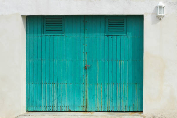 turquoise wooden garage door stock photo
