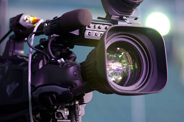 tv camera in a concert hall Professional digital video camera. accessories for 4k video cameras.Professional digital video camera. accessories for 4k video cameras. camera photographic equipment stock pictures, royalty-free photos & images