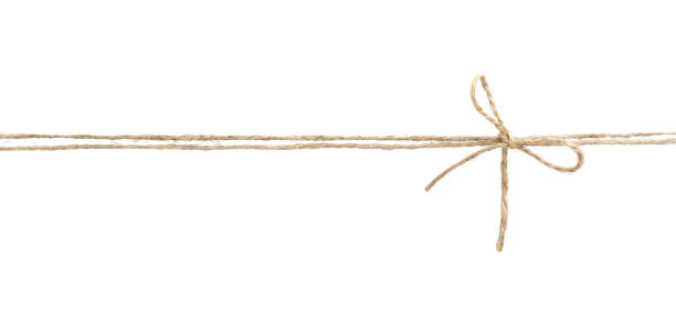 twine rope with bow isolated. - aniagem de cânhamo imagens e fotografias de stock