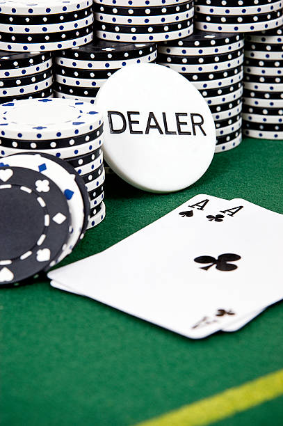 Two Aces in Front of Dealer and Gambling Chips stock photo