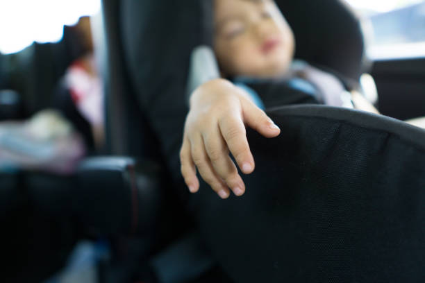 Two asian kids in the car during their family road trip stock photo