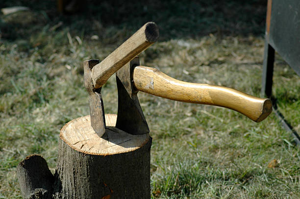 Two axes in stump stock photo
