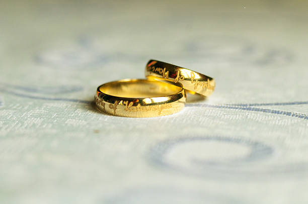 Two beautiful engraved wedding rings stock photo