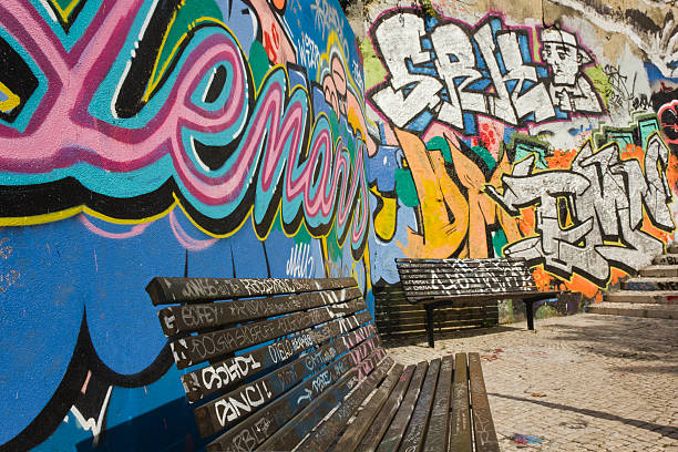 Two benches sprayes with graffiti stock photo