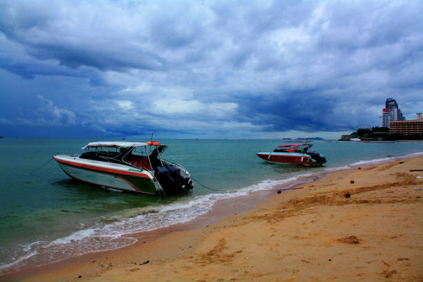 Two Boats Anchored at Pattaya Beach stock photo
