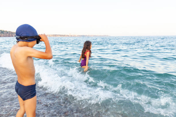 Two brothers are swimming Two brothers are swimming tunisian girls stock pictures, royalty-free photos & images