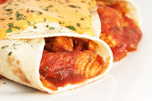 Two burritos with cheese and chili sauceMy other similar images