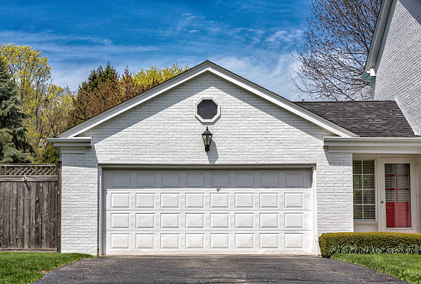 Two car wooden garage Traditional two car wooden garage brick house stock pictures, royalty-free photos & images