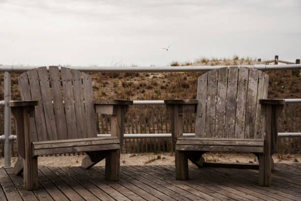 Two chairs on Atlantic City boardwalk. New Jersey stock photo
