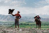 istock Two eagle hunters  in steppe in Kyrgyzstan 1341309943