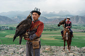 istock Two eagle hunters  in steppe in Kyrgyzstan 1341309946