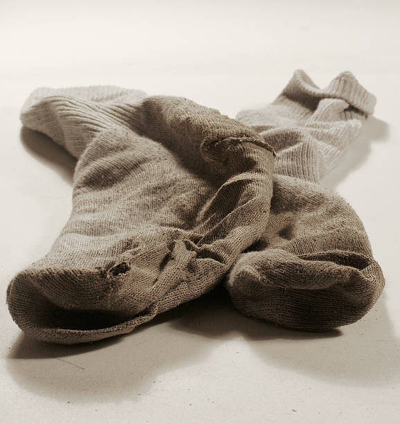 two-filthy-dirty-socks-on-a-white-background-picture-id139742163