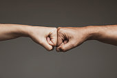 istock Two Fists 1285743620