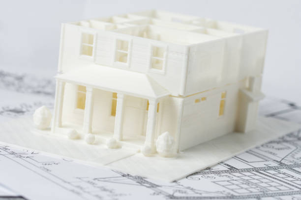 Two floors model of the family house printed on a 3D printer with white filament by FDM technology for architectural use. stock photo