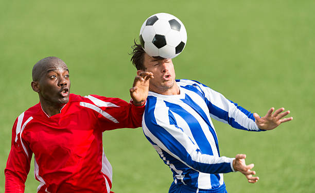 Two Footballers In Action stock photo