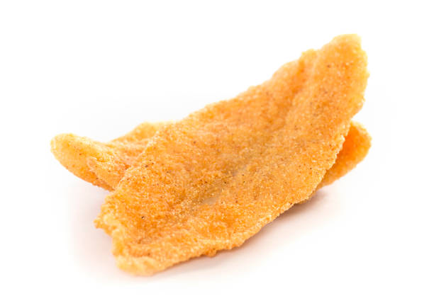 Two Fresh Fish Fillets Fried and Isolated on a White Background Two Fresh Fish Fillets Fried and Isolated on a White Background fish fry stock pictures, royalty-free photos & images