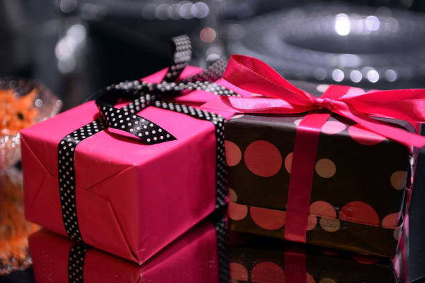 Two gift boxes with bows for Christmas, a birthday stock photo