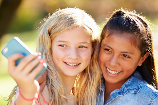 Two Girls Taking Selfie With Mobile Phone Stock Photo Two Girls Taking Selfie With Mobile Phone Stock Photo