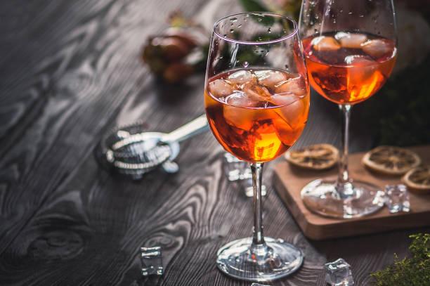 Two glasses of Spritz cocktails Two glasses of Spritz cocktails on the wooden table aperitif stock pictures, royalty-free photos & images