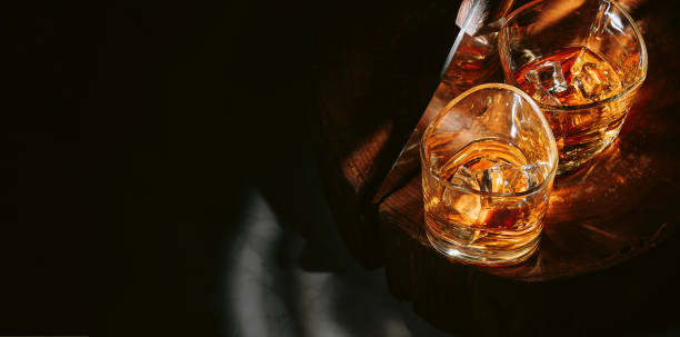 two glasses of whiskey stock photo