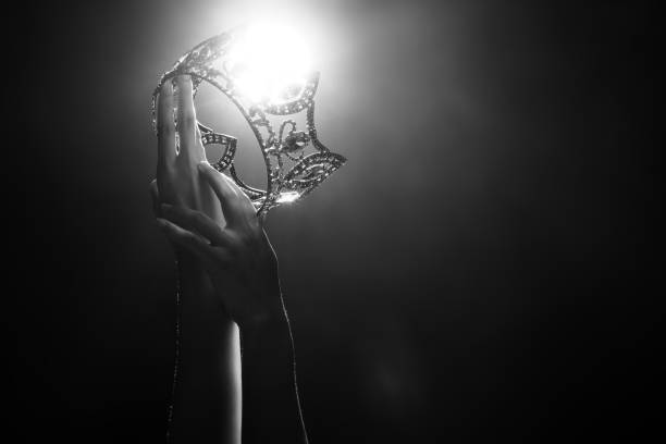 Two hands reach Diamond Crown as Miss Beauty Queen Pageant Contest Silhouette abstract of two hands try to reach Diamond Crown as Miss Beauty Queen Pageant Contest as final competition, finale winner moment. Backlit smoke low exposure dark background copy space beauty pageant stock pictures, royalty-free photos & images
