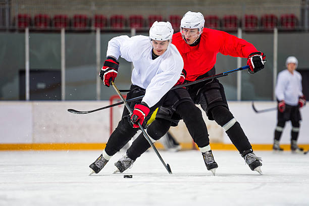 Two Ice Hockey Players Dueling stock photo