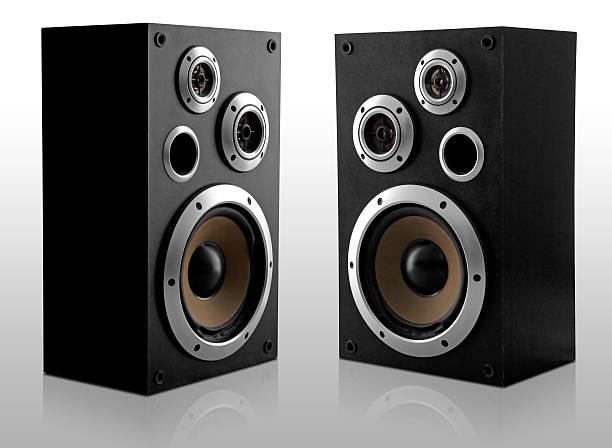 Two large speakers angled inwards Two isolated modern loudspeakers on a white background. Clipping path included... audio electronics stock pictures, royalty-free photos & images