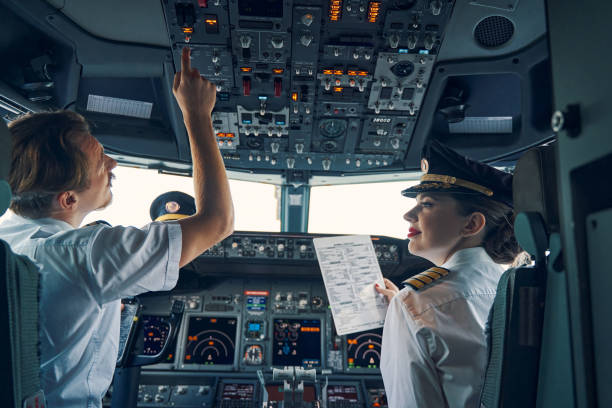 Two licensed pilots getting ready for the take-off stock photo
