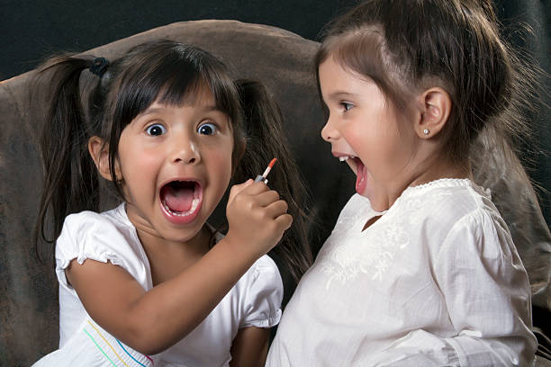 Two little girls playing stock photo