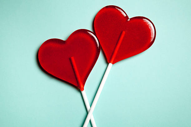 Two lollipops. Red hearts. Candy. Love concept. Valentine day. stock photo