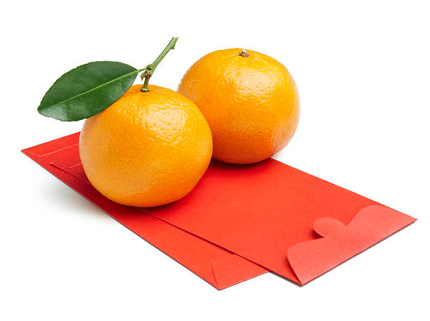 mandarin orange with red packet isolated on white