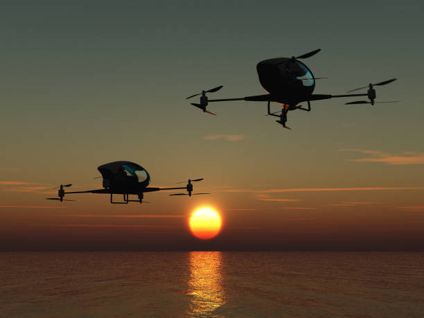 dois drones tripulados sobrevoando o mar - drone sobrevoando o mar - fotografias e filmes do acervo