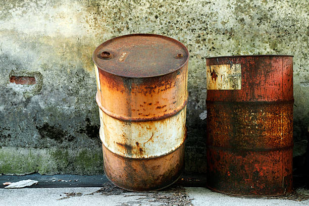 Two old rusty barrels stock photo