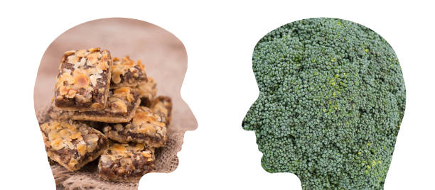 Two people one is eating healthy food, vegatables like broccoli the other person is chooses unhealthy cake, diet and fitness concept Two people one is eating healthy food, vegatables like broccoli the other person is chooses unhealthy cake, diet and fitness concept diabetic foot stock pictures, royalty-free photos & images
