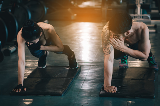 Two People Sporty Put Your Hands On The Floor And Hold The