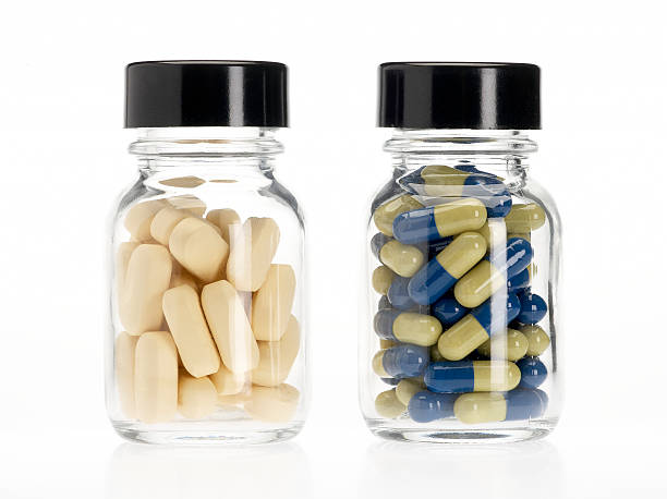 two pills bottles - två burkar piller bildbanksfoton och bilder