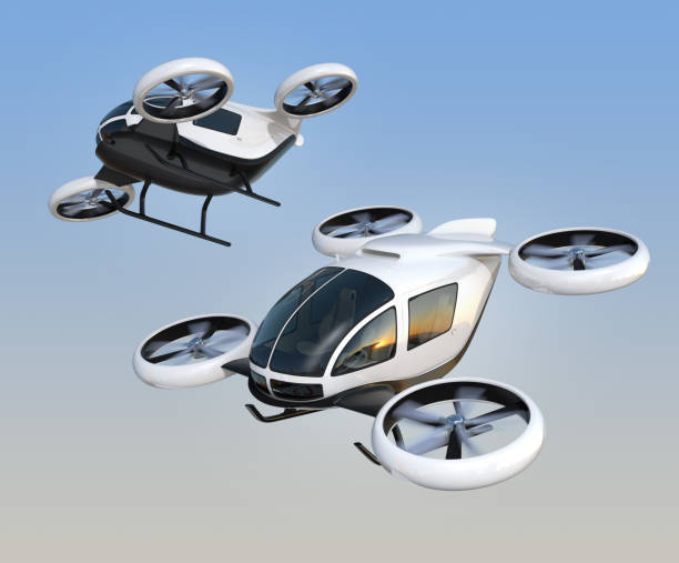 Two self-driving passenger drones flying in the sky stock photo