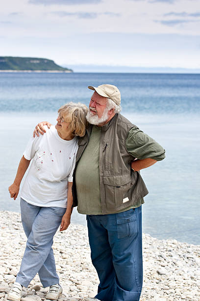 Two Seniors on the beach stock photo