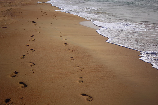 Two Sets Of Footprints Side By Side At The Wet Beach Stock Photo ...