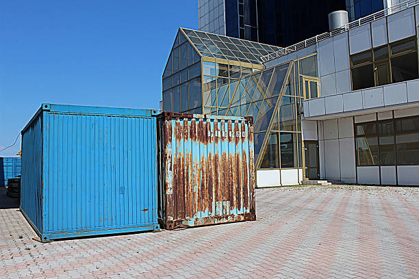 Two shipping containers: old and new stock photo
