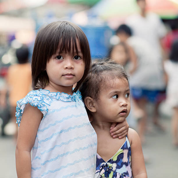 Two siblings  philippines girl stock pictures, royalty-free photos & images