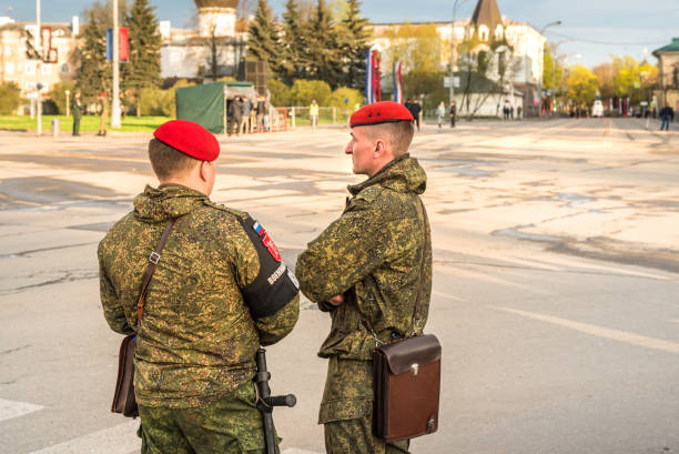 Two soldiers of Special Forces Russian military with red berets on the square of Pskov, Russia Pskov, Russian Federation - May 4, 2018: Two soldiers of Special Forces Russian military with red berets on the square of Pskov, Russia pskov russia stock pictures, royalty-free photos & images
