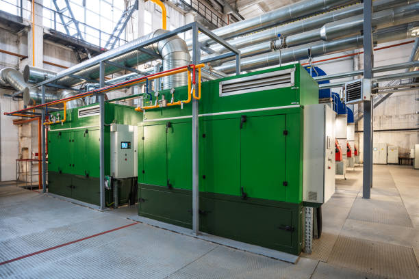 Two stationary gas electric generators Two stationary high power gas electric generators  in boiler house generator stock pictures, royalty-free photos & images