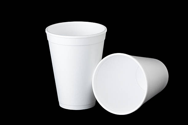 two styrofoam cups on black - polystyreen stockfoto's en -beelden